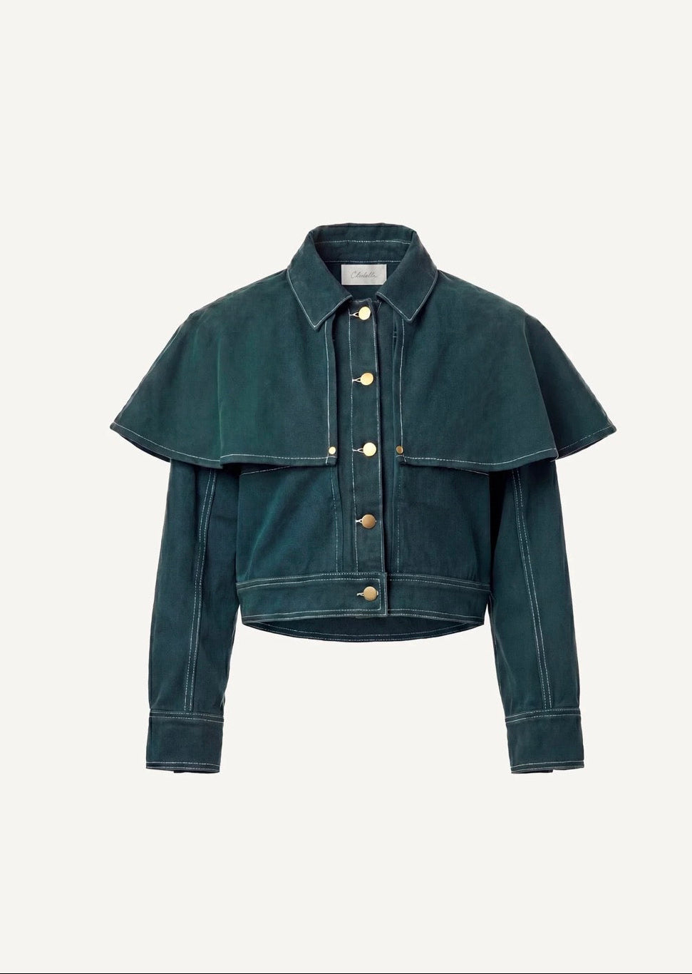 A cropped dark teal denim jacket with a unique layered ruffle collar, button front, and contrast stitching, displayed on a clean off-white background.